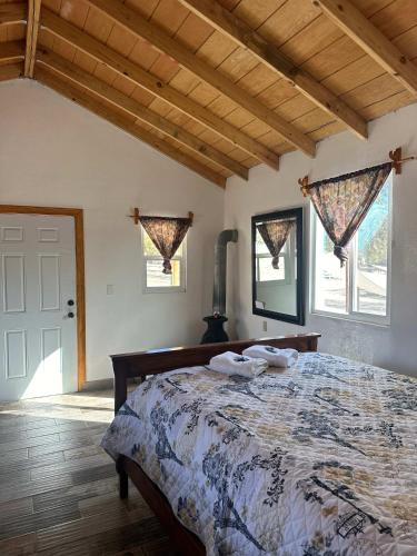 a bedroom with a bed with towels on it at #11- Rancho Meling in Camalú