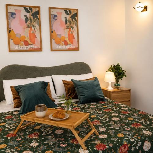 a bedroom with a bed with a coffee table on it at La Via Per Erice in Casa Santa