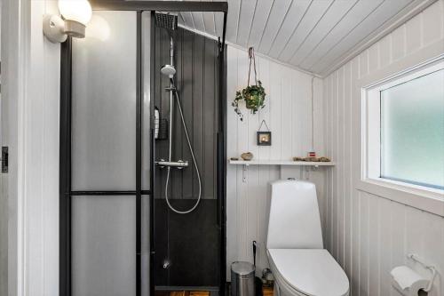 a bathroom with a shower and a toilet in it at JB274-Fjerritslev-Ronnevej-10 in Kollerup
