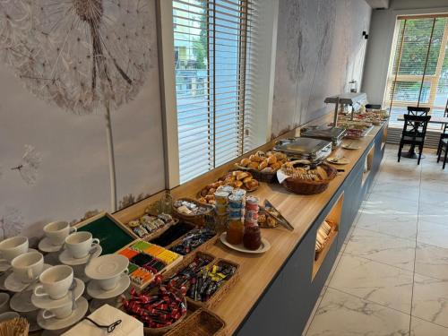 a buffet line with a lot of food on it at Marina in Międzyzdroje