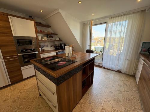 a kitchen with an island in the middle of it at Ferienhaus Nehring in Bad Neuenahr-Ahrweiler