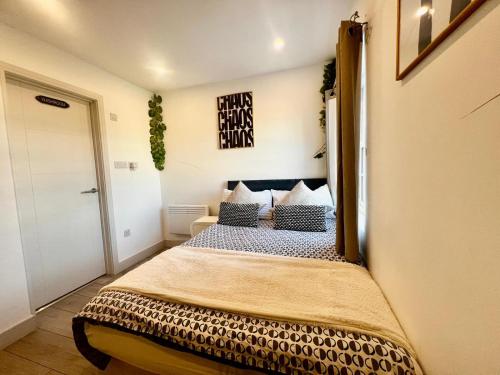a bedroom with a bed in a room at Sutton & Stone in Sutton