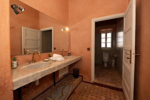 a bathroom with a sink and a toilet at Villa Dar Luz in Marrakesh