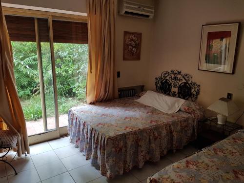 Postel nebo postele na pokoji v ubytování Nuevo Castillo Hotel