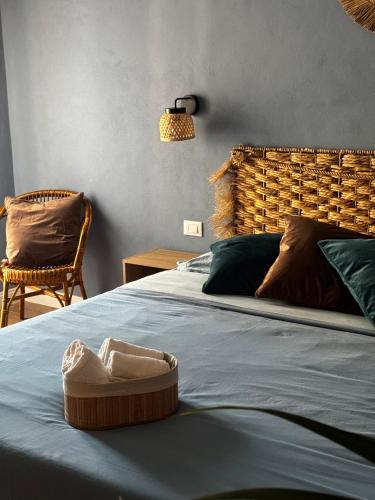 a bed with a bowl on top of it at Casa Agata in Chioggia