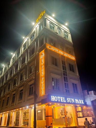 a hotel building with a sign on it at night at HOTEL SUN PARK Palace in Birātnagar