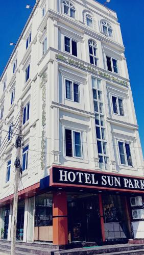 a large white building with a hotel sign on it at HOTEL SUN PARK Palace in Birātnagar