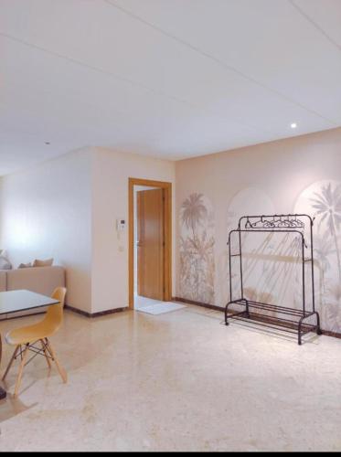 an empty room with a chair and a goal at Peninsula promenade in Tamaris