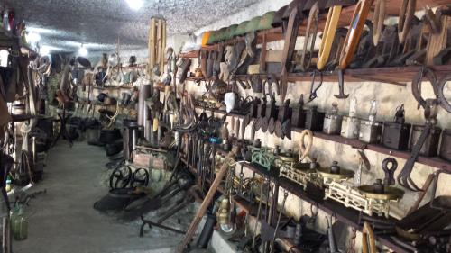 a room filled with lots of tools on a wall at Guesthouse Mala Venecija in Virpazar