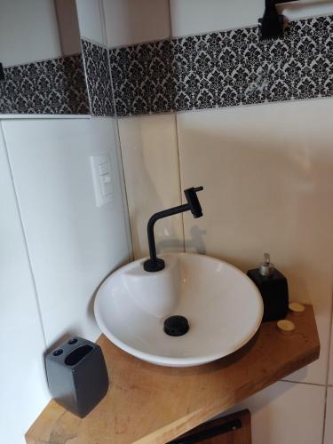 a bathroom sink with a faucet on a counter at Frida's Haus in Nova Petrópolis