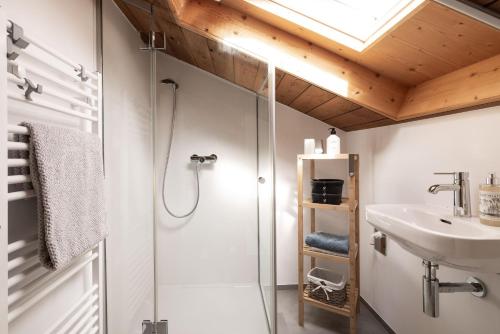 a bathroom with a shower and a sink at Gästehaus Kaufmann in Mellau