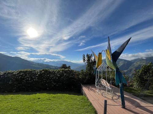 a group of wind sculptures sitting on a deck at Riverside Estate with Jacuzzi 9 Bedroom 7 Bath in Baños