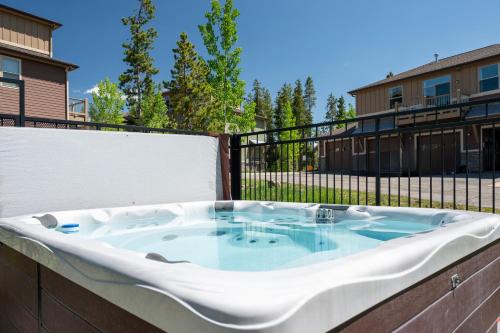 a jacuzzi tub on the back of a building at Timbers 9-4 in Fraser