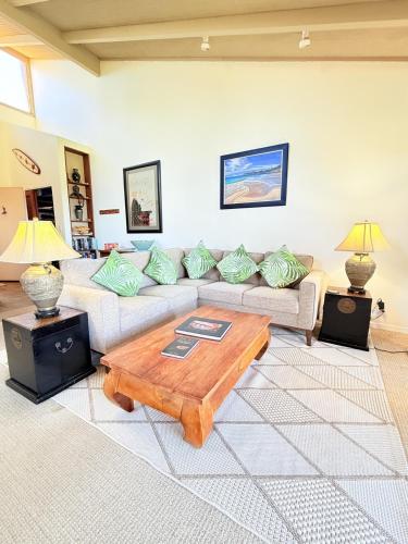 a living room with a couch and a coffee table at Best Ocean and Mountain View! in Waikoloa Village