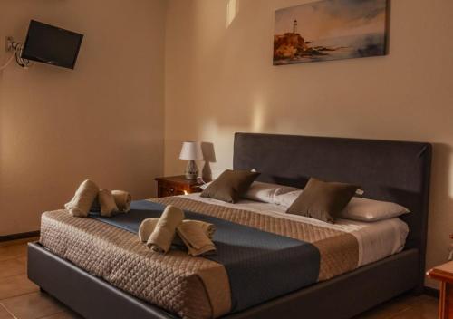 a bedroom with a large bed with two pillows at DaMaHouse in Monastir