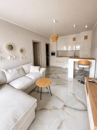 a living room with a couch and a table at Amore Fanari in Fanari