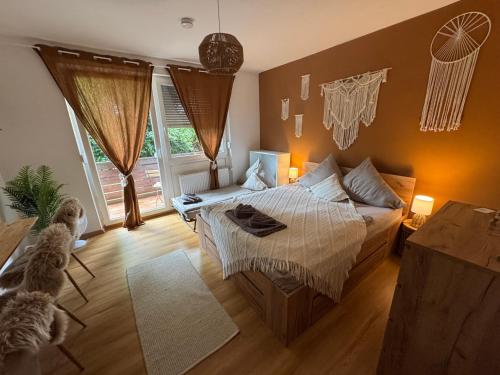 a bedroom with a bed and a dog in it at BOHO Apartment Terra in Bad Reichenhall