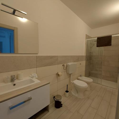 a bathroom with a toilet and a sink and a shower at A casa di Adua in Cupello