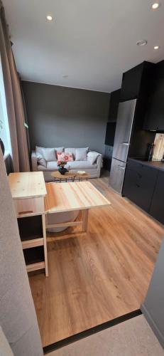 a living room with a couch and a table at Lösen Retreat in Lyckeby