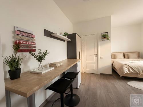 a small bedroom with a desk and a bed at RentHouse Apartments-Old Town Studio #2 in Chişinău