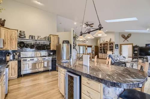 a large kitchen with a large counter top in it at Mountain Retreat - Deck Views - Sleeps 10 in Black Hawk