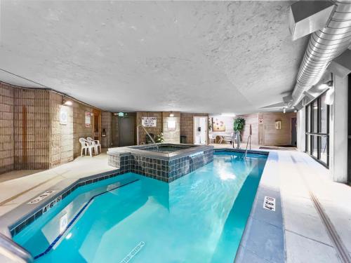 an indoor swimming pool with blue water in a house at 432 Marina Place in Dillon