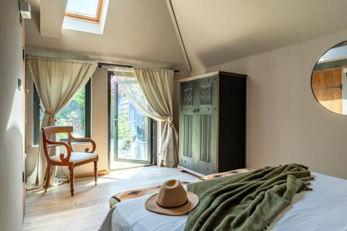 a bedroom with a bed with a hat on it at 3 Bed in Ditchingham oc-s42751 in Ditchingham