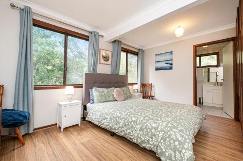 a bedroom with a bed and a window at Relax Moore - Close to Beach in Guilderton