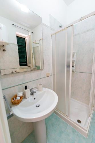 a bathroom with a sink and a shower at Casa Antonella in Trabia