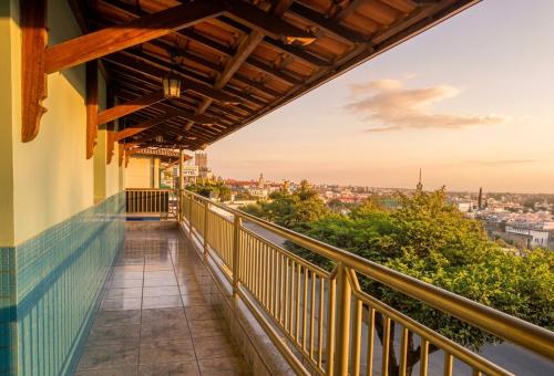 a balcony with a view of a city at Hotel Coutinho PIO XII in Pirapora
