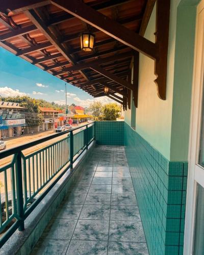 a balcony with a view of a street at Hotel Coutinho PIO XII in Pirapora