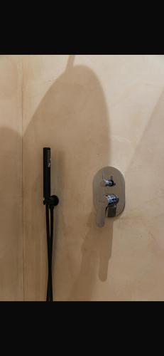 a bathroom stall with a sink in a wall at Panorama Villa Infinity Pool in Shëngjin