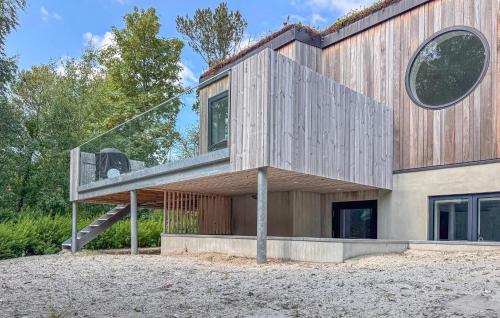 a house with a staircase on the side of it at Amazing Home In Grenaa With Kitchen in Grenå