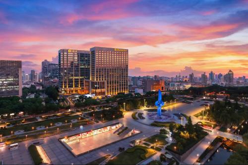 a view of a city at night with buildings at Shangri-La Jinan in Jinan