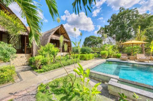 an image of a villa with a swimming pool at Gati Cottage in Nusa Penida