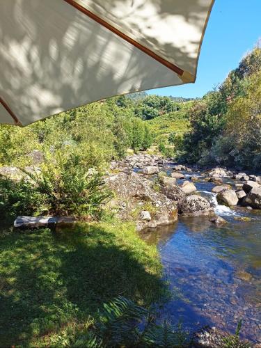 a view of a river from under a bridge at Camping Monteluz Lago Ranco in Lago Ranco