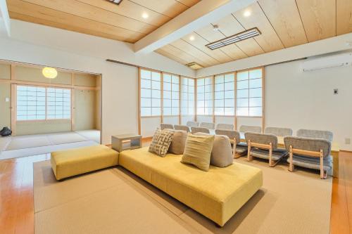 a living room with a couch and chairs in a room at Yunokawa Kagura in Hakodate