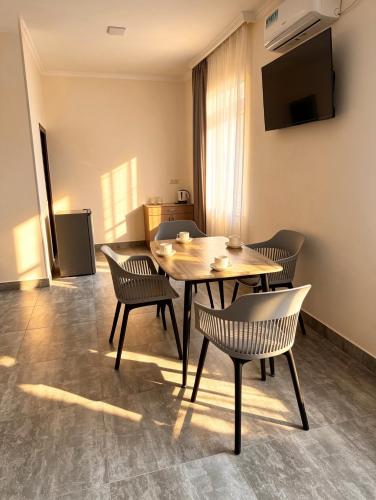 a dining room with a table and chairs at River Light-Guest House in Alaverdi