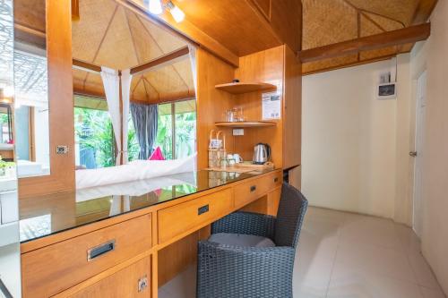 a bathroom with a counter and a sink in a room at Pattaya Bungalow II, Totally Private Pool in Pattaya South