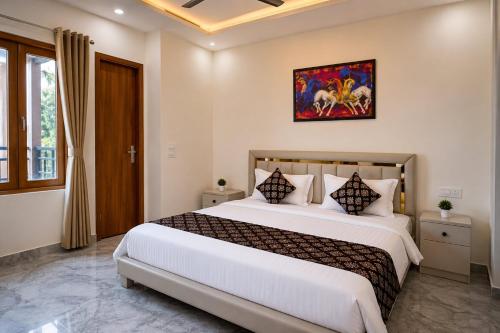 a bedroom with a large bed in a room at The Ushmaya Lifestyle Wellness Resort Near Rishikesh in Haridwār