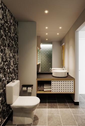 a bathroom with a toilet and a sink at Atura Oran Park in Gledswood Hills