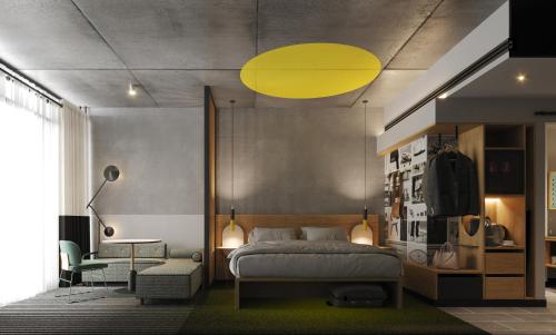 a bedroom with a bed and a yellow light at Atura Oran Park in Gledswood Hills