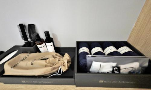 a box with a bunch of hair brushes and a bag at De Lamour Hotel in Tongyeong