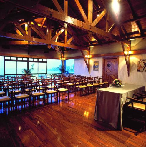 a large room with tables and chairs in it at Hotel Presidente in Mar del Plata