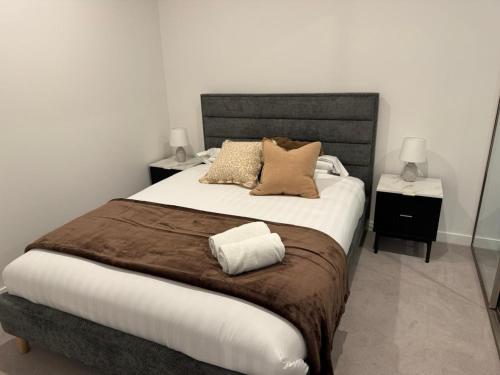a bedroom with a large bed with two night stands at Stylish 1BR Getaway and Option for 2nd Br in Campbell