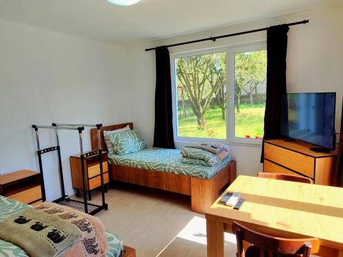 a living room with a couch and a window at Goranovi House in Pleven
