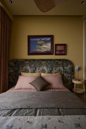 a bedroom with a large bed with a head board at LangX Ecopark Sky Forest - Dolce Apartment in Kim Quan