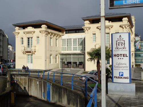 a hotel building with a sign in front of it at Hotel Villa De Betanzos in Betanzos