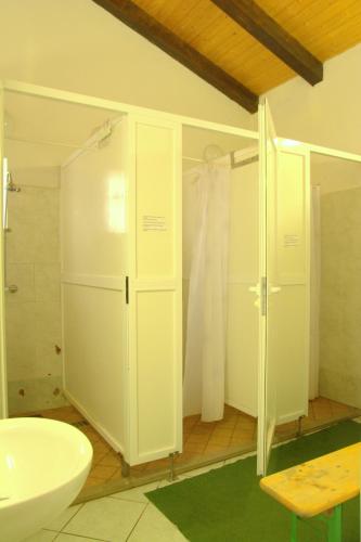 a bathroom with a sink and a shower and a toilet at Avtokamp pri mlinu - Tent or Camper Pitch - Dujčeva domačija in Vremski Britof