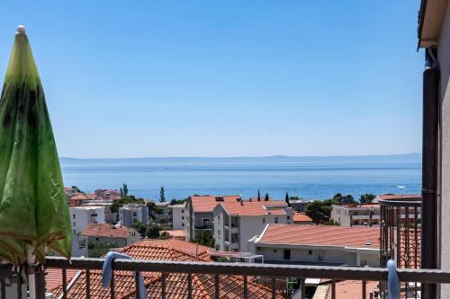 a view of a city and the ocean from a balcony at Apartments Amaris in Promajna